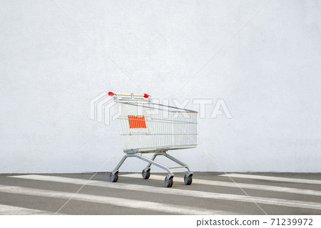 Empty Trolley at the Supermarket. Grocery Cart on the White Wall Store. Shopping Cart Trolley Stands near Mall with Copy Space. Black Friday. Side View. Shopping Online. Shopping Concept. E-commerce Empty Trolley at the Supermarket. Grocery Cart on the White Wall Store. Shopping Cart Trolley Stands near Mall with Copy Space. Black Friday. Side View. Shopping Online. Shopping Concept. E-commerce 71239972