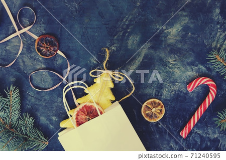 New Year's toys, spices, spruce branches, Christmas background, concept of congratulations, postcard New Year's toys, spices, spruce branches, Christmas background, concept of congratulations, postcard 71240595