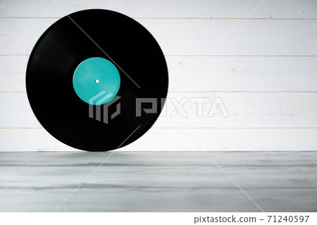 Vinyl record on white wooden background Vinyl record on white wooden background 71240597