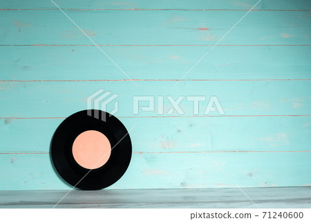 Vinyl record on blue wooden background 71240600