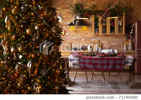 Close up Christmas tree in modern dining room with table Close up Christmas tree in modern dining room with table 71240980