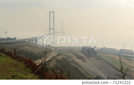 Magnificent view of Osman Gazi bridge on a foggy day 71241222