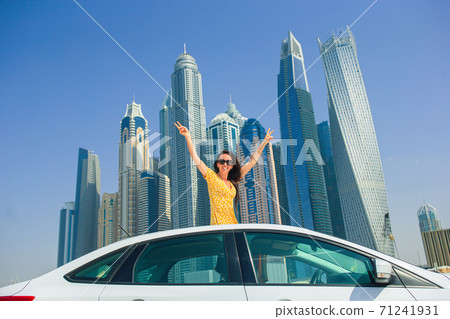 Summer car trip and young woman on vacation 71241931