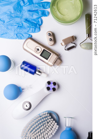 set of different hardware equipment with vacuum jars, nephrite roll and massage brush. anti-age and anti-cellulite set for home skin care procedure. beauty concept set of different hardware equipment with vacuum jars, nephrite roll and massage brush. anti-age and anti-cellulite set for home skin care procedure. beauty concept 71242613
