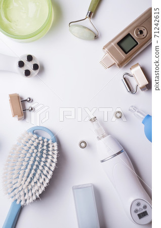 set of different hardware equipment with vacuum jars, nephrite roll and massage brush. anti-age and anti-cellulite set for home skin care procedure. beauty concept 71242615