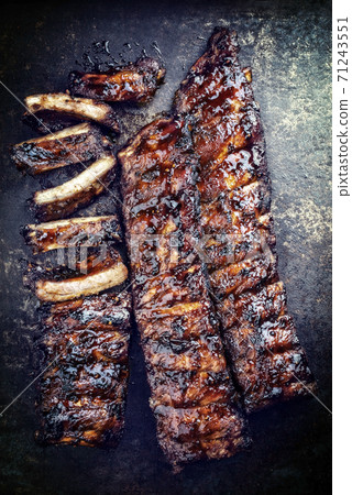 Barbecue spare ribs St Louis style with hot honey chili marinade 71243551