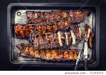 Barbecue spare ribs St Louis style with hot honey chili marinade 71243553