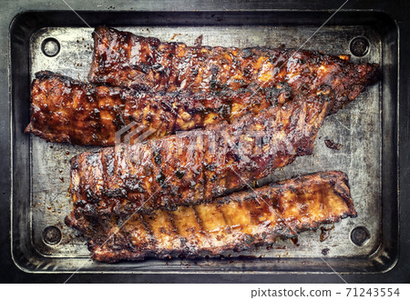 Barbecue spare ribs St Louis style with hot honey chili marinade 71243554