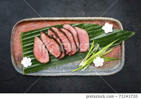 dry aged fillet steak sliced with daikon and leek 71243720