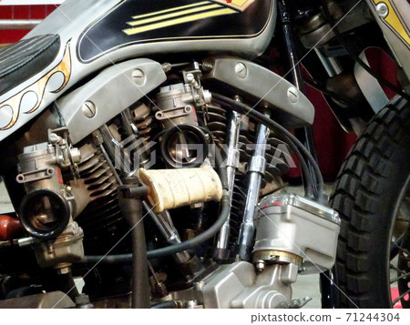 SERDANG, MALAYSIA -JULY 29, 2017: Chopper type motorcycle engine. Miscellaneous design of v-twin engine powered with different horsepower.  71244304