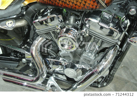 SERDANG, MALAYSIA -JULY 29, 2017: Chopper type motorcycle engine. Miscellaneous design of v-twin engine powered with different horsepower.  71244312