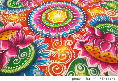 KUALA LUMPUR, MALAYSIA -OCTOBER 16, 2016: Rangoli. Colorful pattern made with colored rice, lentils and powder during Diwali, Hindu New Years and the Hindu Festival of Light.  71244374