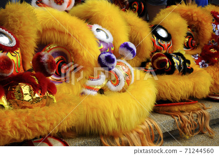 SEREMBAN, MALAYSIA -FEBRUARY 2, 2017: Chinese lion mask or lion head used to performed lion dance during Chinese New Year Festival at Seremban, Malaysia. Beautiful & colourful. SEREMBAN, MALAYSIA -FEBRUARY 2, 2017: Chinese lion mask or lion head used to performed lion dance during Chinese New Year Festival at Seremban, Malaysia. Beautiful & colourful. 71244560