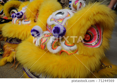 SEREMBAN, MALAYSIA -FEBRUARY 2, 2017: Chinese lion mask or lion head used to performed lion dance during Chinese New Year Festival at Seremban, Malaysia. Beautiful & colourful.  71244569