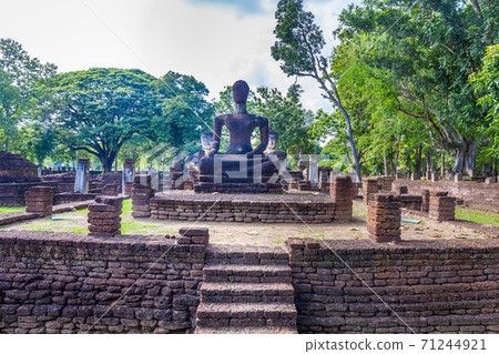 Landmark of Buddha image made of ancient bricks in the Kamphaeng Phet Historical Park, Thailand. Landmark of Buddha image made of ancient bricks in the Kamphaeng Phet Historical Park, Thailand. 71244921