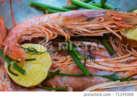 dark red brown tomato and whole vegetables on wooden background dark red brown tomato and whole vegetables on wooden background 71245006