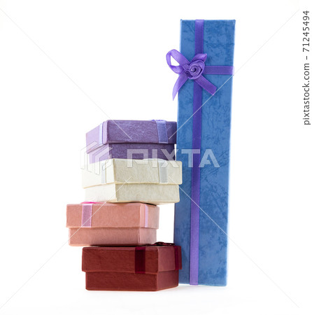 stack of giftbox square red, pink and long gift blue on an isolated background stack of giftbox square red, pink and long gift blue on an isolated background 71245494