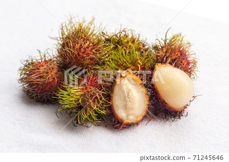 handful rambutan tropical fruit with white core on a white isolated background 71245646
