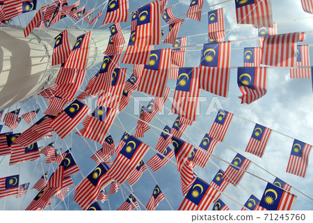 SELANGOR, MALAYSIA -AUGUST 31, 2017: Selective focused small size Malaysia flag tie in large quantities in windy air.  71245760