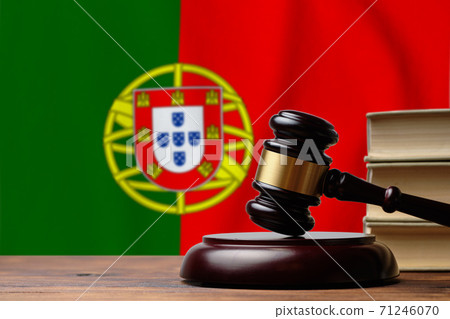 Justice and court concept in Portuguese Republic. Judge hammer on a flag background Justice and court concept in Portuguese Republic. Judge hammer on a flag background 71246070