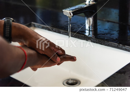 man hands rubbing with soap and water in sinks man hands rubbing with soap and water in sinks 71249047