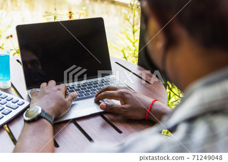 businessman sitting on desk work from home using laptop computer businessman sitting on desk work from home using laptop computer 71249048