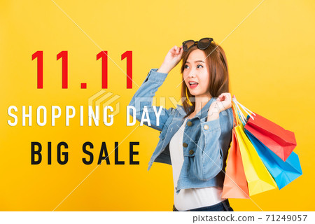 woman teen smiling standing with sunglasses excited holding shopping bags multi color 71249057