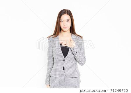 Business woman putting hand on chest Business woman putting hand on chest 71249720