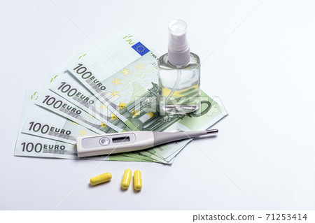 tablets and a thermometer on the table. protection from the virus tablets and a thermometer on the table. protection from the virus 71253414