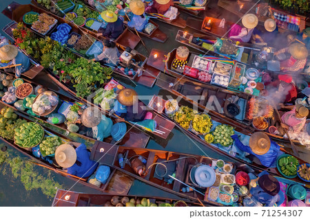 Damnoen Saduak Floating Market or Amphawa. Local people sell fruits, traditional food on boats in canal, Ratchaburi District, Thailand. Famous Asian tourist attraction destination. Festival in Asia. 71254307