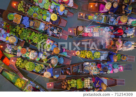 Damnoen Saduak Floating Market or Amphawa. Local people sell fruits, traditional food on boats in canal, Ratchaburi District, Thailand. Famous Asian tourist attraction destination. Festival in Asia. 71254309