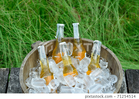 old bottles of beer in wooden bucket with ice old bottles of beer in wooden bucket with ice 71254514