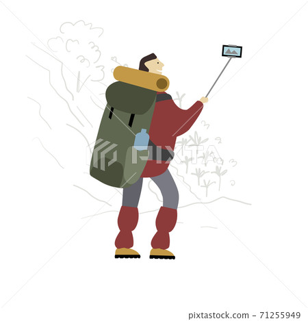 Hiker with backpack takes selfie in mountains. 71255949