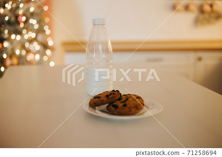 Glass of milk and plate of cookies for santa Glass of milk and plate of cookies for santa 71258694