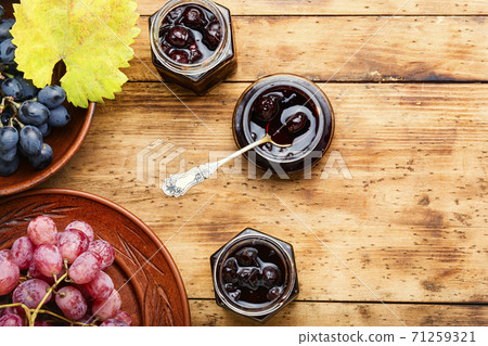 Jar of grape jam. Jar of grape jam. 71259321