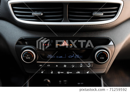 Interior view of a modern new car. Climatronic or air conditioner system. Interior view of a modern new car. Climatronic or air conditioner system. 71259592