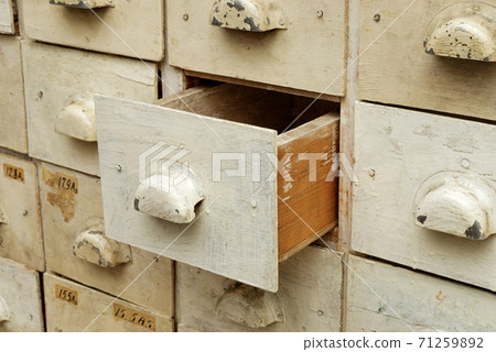 Old wooden cabinet with drawers Old wooden cabinet with drawers 71259892
