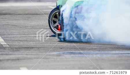 Close up drift race car increasing speed on drift playground Close up drift race car increasing speed on drift playground 71261979