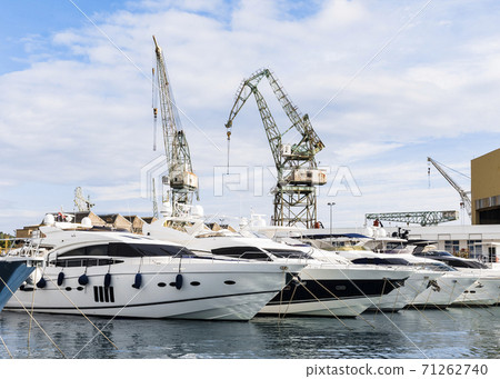 Port of Trogir, Croatia, with luxury boat parking and port cranes Port of Trogir, Croatia, with luxury boat parking and port cranes 71262740