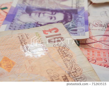 Pound money of United kingdom close up on white Pound money of United kingdom close up on white 71263515