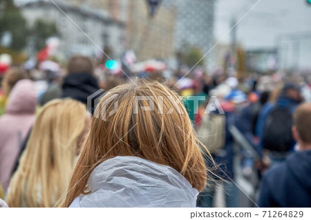 A crowd of people goes during the rally A crowd of people goes during the rally 71264829