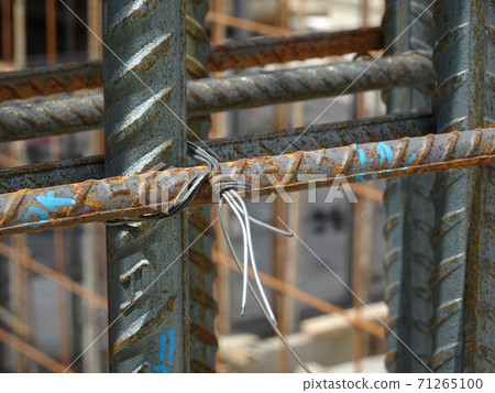 SEREMBAN, MALAYSIA -AUGUST 05, 2017: Steel reinforcement bar used to reinforced concrete at the construction site. It was tied together using tiny wires. SEREMBAN, MALAYSIA -AUGUST 05, 2017: Steel reinforcement bar used to reinforced concrete at the construction site. It was tied together using tiny wires. 71265100