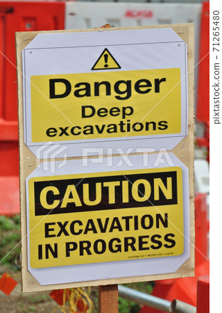 PERAK, MALAYSIA -FEBRUARI 02, 2016: Safety signage "Danger - Deep Excavation" at the construction site. Safety signage used to make sure workers aware activities ahead and to avoid accident happen PERAK, MALAYSIA -FEBRUARI 02, 2016: Safety signage "Danger - Deep Excavation" at the construction site. Safety signage used to make sure workers aware activities ahead and to avoid accident happen 71265480