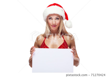 Sexy female bodybuilder in a red swimsuit and Christmas hat, copy space, isolated on white Sexy female bodybuilder in a red swimsuit and Christmas hat, copy space, isolated on white 71270424