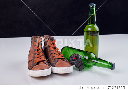 Pair of shoes with beer bottles. Pair of shoes with beer bottles. 71271225