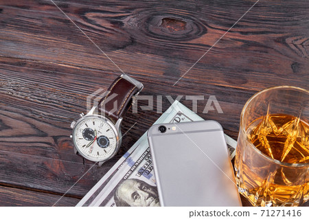 Luxury handwatch with smartphone and brandy. Luxury handwatch with smartphone and brandy. 71271416