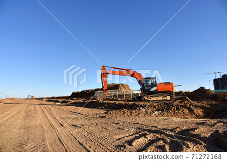 Excavator Working On Road Construction in City. Excavator Working On Road Construction in City. 71272168