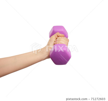 female hand holds a plastic pink dumbbell on a white isolated background female hand holds a plastic pink dumbbell on a white isolated background 71272603