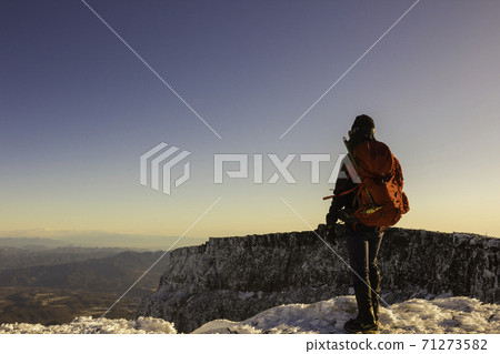 A man standing on the summit of Mt. Iodake in winter 71273582