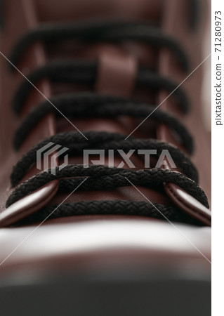 Closeup detail shot of brown leather sneaker 71280973